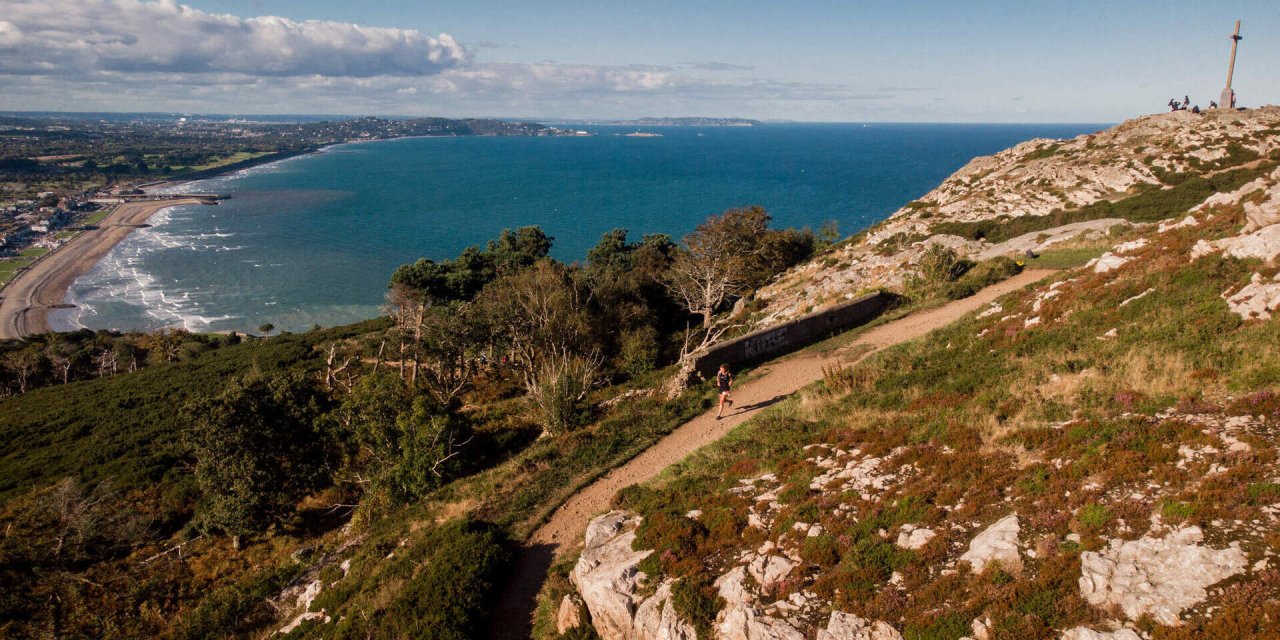 water in the background with green stone